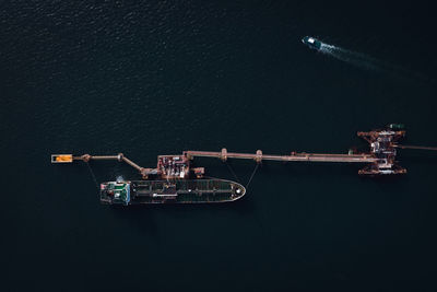 High angle view of crane against sky at night