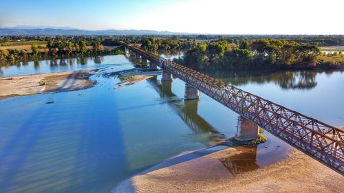 Bridge over river against sky