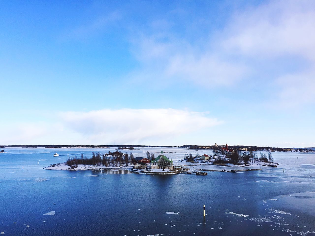 sea, sky, architecture, built structure, building exterior, water, nautical vessel, blue, cloud - sky, nature, scenics, no people, outdoors, tranquility, travel destinations, beauty in nature, beach, day, horizon over water, sailing ship