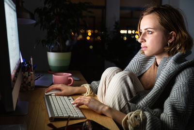 Close-up of businesswoman working at home