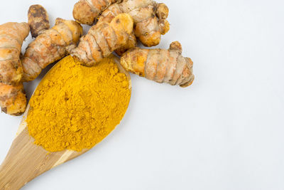 High angle view of food in plate against white background