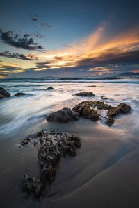 Scenic view of sea against sky during sunset