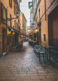 Empty alley amidst buildings in city