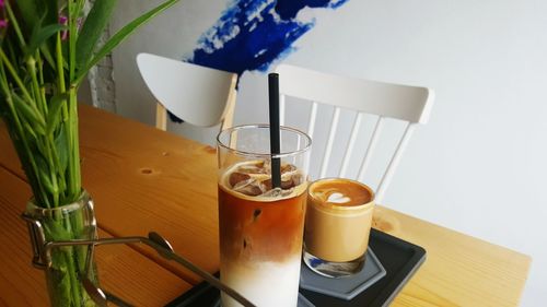 High angle view of coffee and drink on table