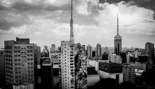 Modern buildings in city against sky