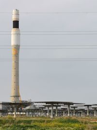 Low angle view of factory against sky