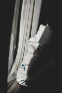 Close-up of man hand on window