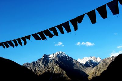 Scenic view of mountains against cloudy sky