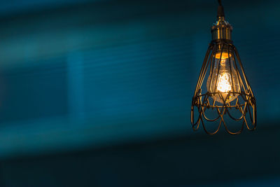 Low angle view of illuminated light bulb