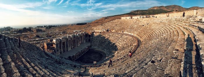 Panoramic view of old ruins against sky