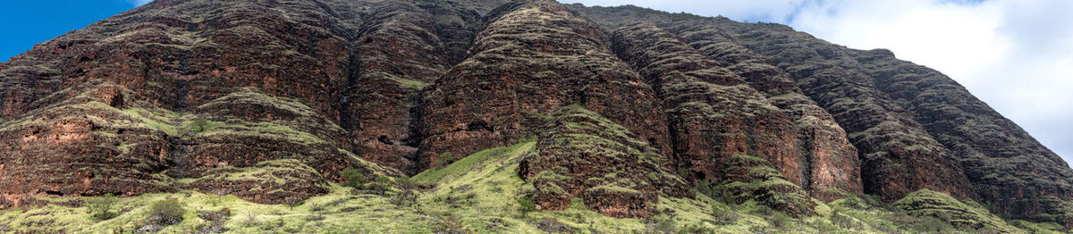 Low angle view of rock formation against sky