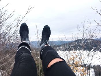 Low section of person on snow covered land