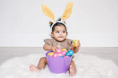 Portrait of cute girl playing with toys on table