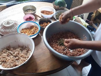 High angle view of person preparing food on table