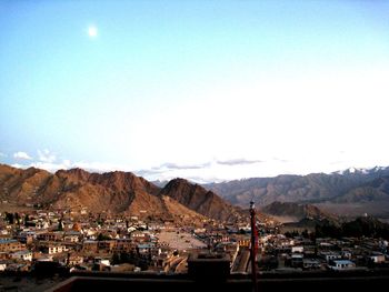 Cityscape with mountain range in background