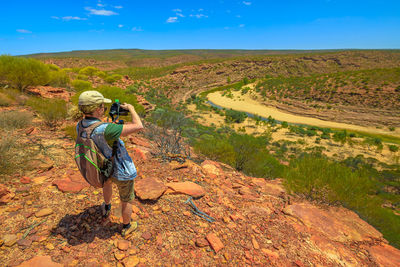 Full length of man photographing at kalbarri national park 