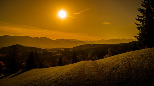 Scenic view of landscape against sky during sunset