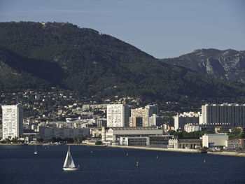 Sailboats in city