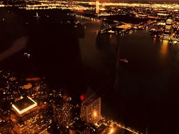 High angle view of illuminated city buildings at night