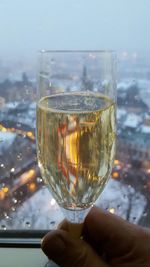 Close-up of hand holding glass of wine