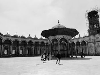 Group of people in front of building. egyptian mosque