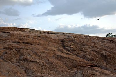 Scenic view of arid landscape against sky