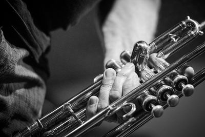 Close-up of human hand on metal