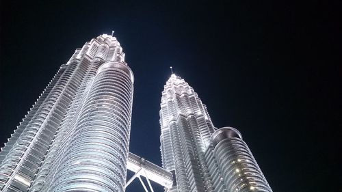 Low angle view of skyscraper at night