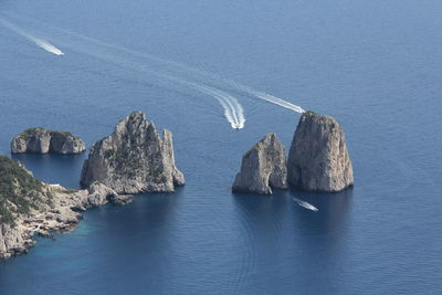 High angle view of rocks in sea