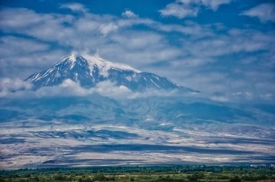 Scenic view of snowcapped mountains against sky
