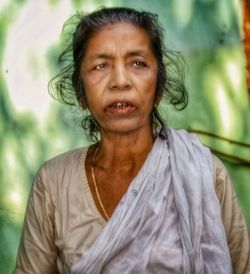 Portrait of woman standing outdoors