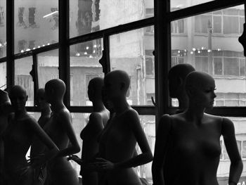 Mannequins by window in store