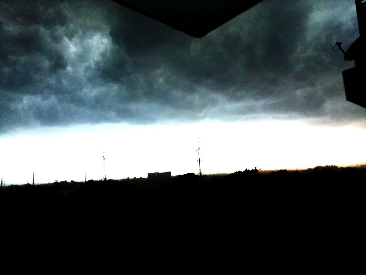 SILHOUETTE OF LANDSCAPE AGAINST CLOUDY SKY