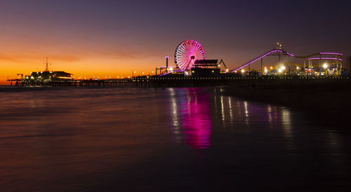 View of illuminated ferris wheel at night