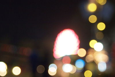 Defocused image of illuminated lights at night