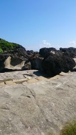 Scenic view of land against clear blue sky