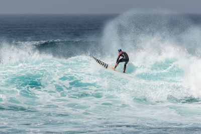 Man surfing in sea