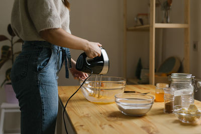 Young woman making christmas cookies