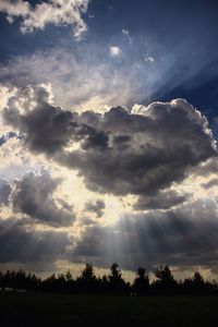 Scenic view of landscape against cloudy sky