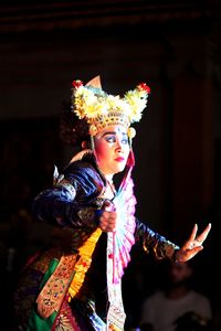 Midsection of woman dancing in traditional clothing