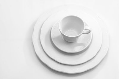 Close-up of coffee cup over white background