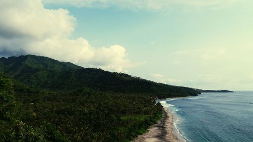 Scenic view of sea against cloudy sky