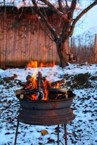 High angle view of fire on log in winter