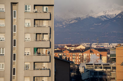 Buildings in city against sky