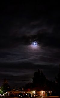 Storm clouds over city at night