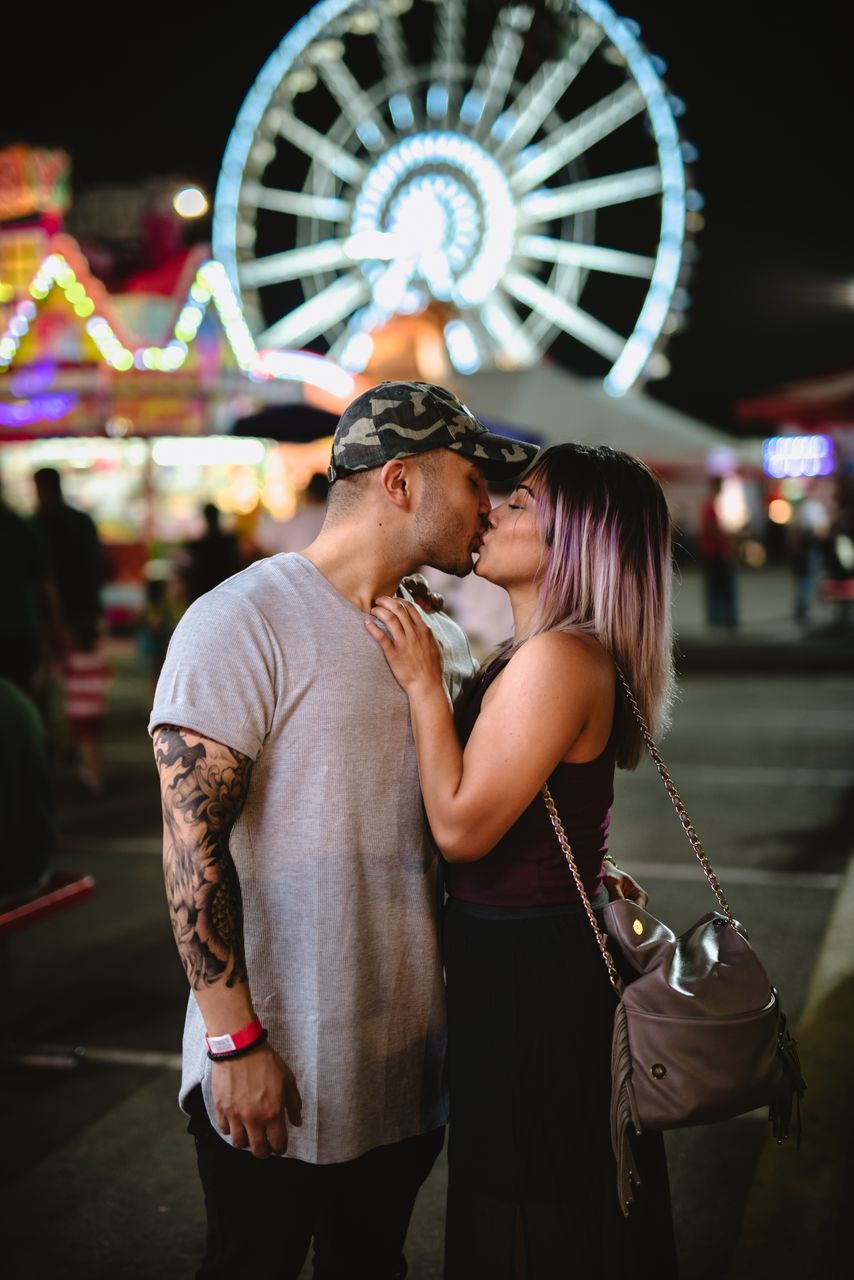 three quarter length, street, lifestyles, leisure activity, focus on foreground, casual clothing, person, holding, outdoors, city life, memories