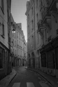 Street amidst buildings in city against sky