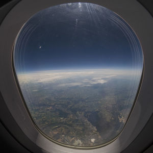 Aerial view of landscape seen through airplane window