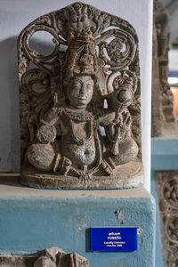 Close-up of statue against building