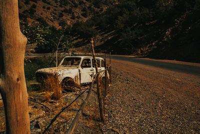 Abandoned car on field